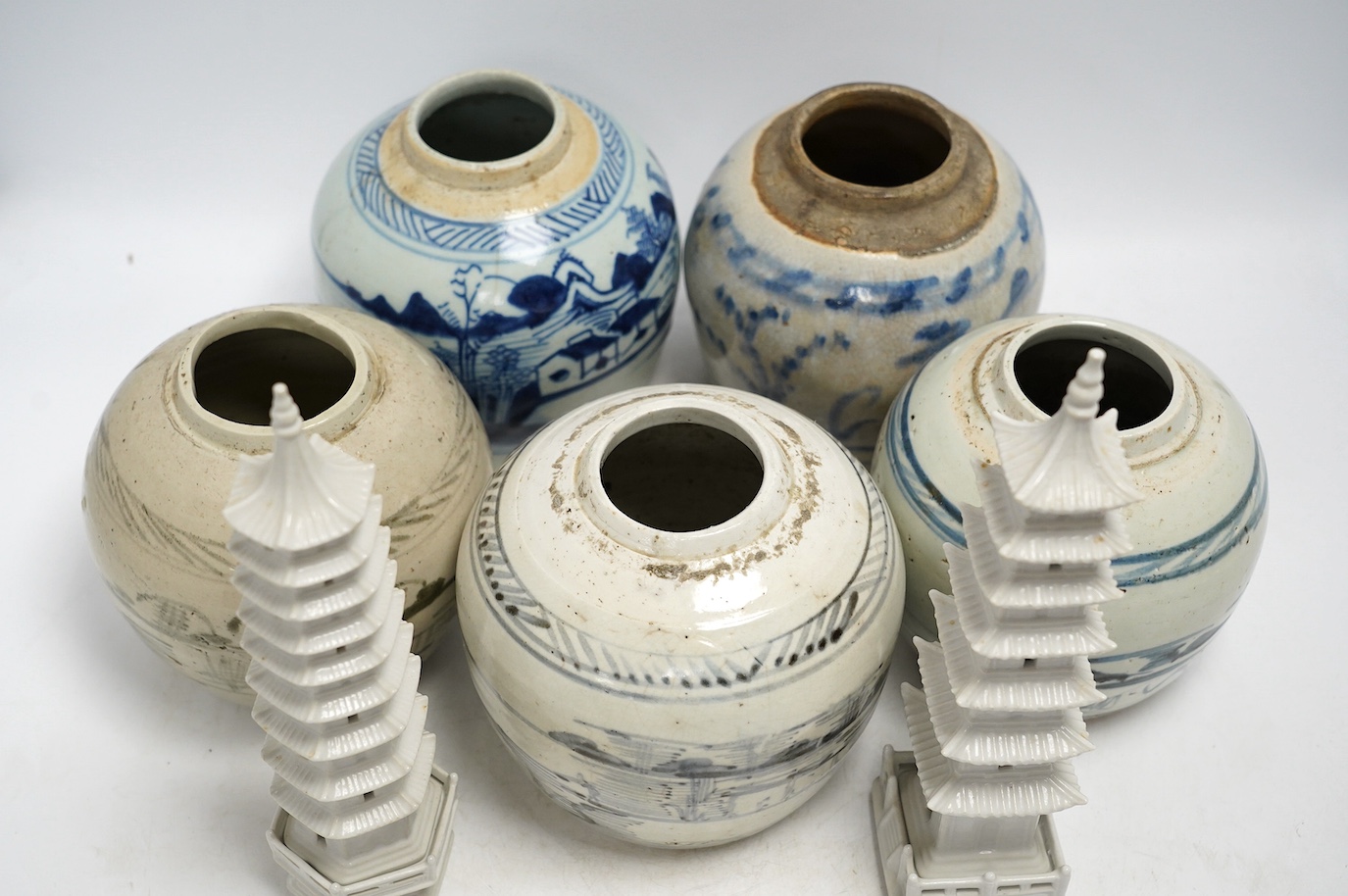 Five 18th/19th century Chinese blue and white ginger jars and two ‘pagoda’ models, tallest 26cm. Condition - fair